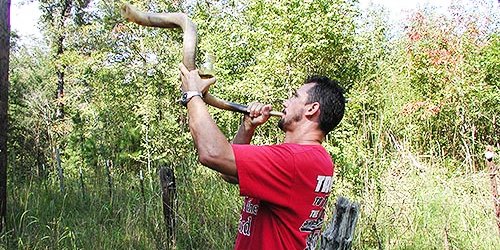 Jeff blowing the shofar